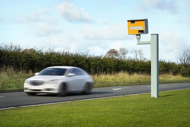 Radar speed camera and fast car on the road