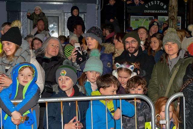 People gather for the switching on of the Christmas tree lights in Buncrana on Friday evening last. Photo: George Sweeney. DER2247GS – 100