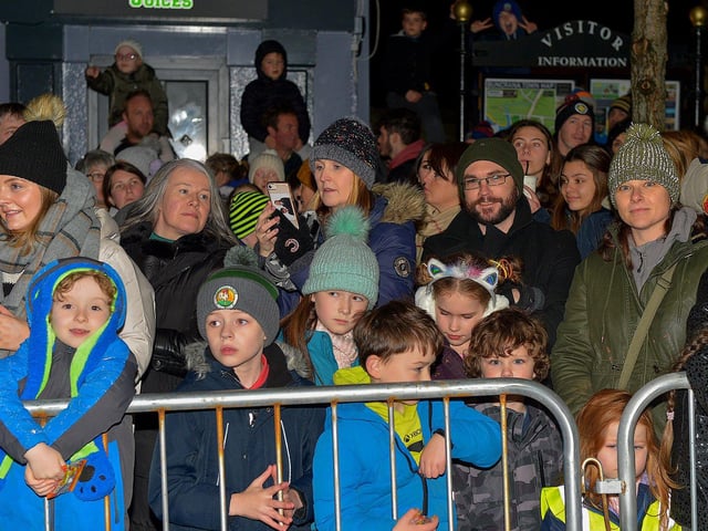People gather for the switching on of the Christmas tree lights in Buncrana on Friday evening last. Photo: George Sweeney. DER2247GS – 100