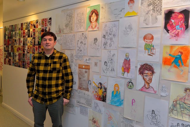 Street Artist and illustrator Elph One aka Brian McFeely pictured with some of his work at the launch of the ‘Doodles in Derry’ exhibition on Saturday in the UV Arts ‘The Urban Art Gallery’ in Bishop Street.  Photo: George Sweeney. DER2301GS – 53