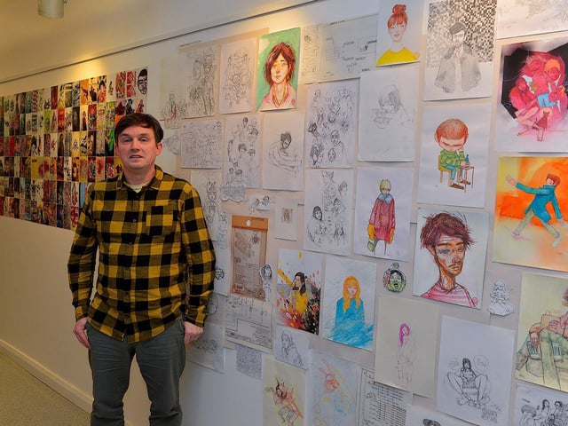 Street Artist and illustrator Elph One aka Brian McFeely pictured with some of his work at the launch of the ‘Doodles in Derry’ exhibition on Saturday in the UV Arts ‘The Urban Art Gallery’ in Bishop Street. Photo: George Sweeney. DER2301GS – 53