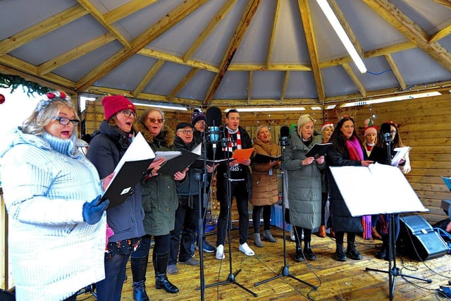 Derry City and Strabane District Council choir singing at Christmas Market in Guildhall Square on Friday afternoon.  Photo: George Sweeney. DER2250GS – 70