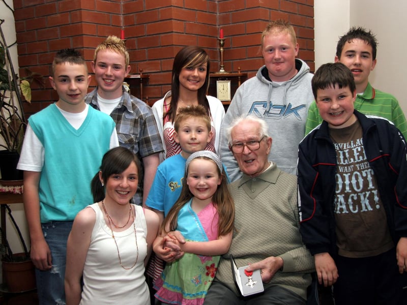 Tom surrounded by his great-grandchildren, Nathan, John, Danielle, Travis, Kevin, Oran, Claire, Nadine and Caolan 0620JML