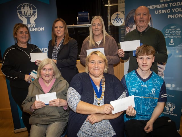 Prize winners with Derry Credit Union staff members.