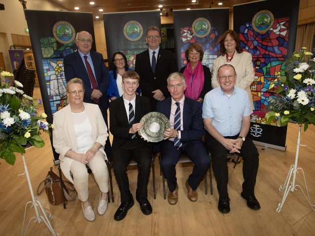Ben. Crawley receiving the Bishop Farren Memorial Prize for Best GCSE Results from Mr. Niall Downey, guest speaker, at Thursday's St. Columb's College Prizegiving. Included at front is Ben's parents. At back are Mr. P. Kelly, board of governors, Mrs. C. McLaughlin, Principal, Mr. D. Chambers, Yead Head, Ms. M. Hamilton and Mrs. G. Canavan, board of governors. (Photos: Jim McCafferty Photography)