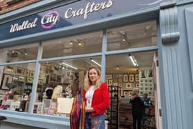 Leona Harkin, pictured outside Walled City Crafters, with her rainbow scarf and the book from Wilkinson's, gifted to her by her grandfather.