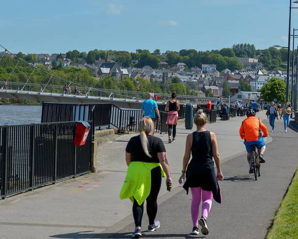 People exercise, in the sunshine, along the Foyle Embankment (File picture). DER2220GS - 012