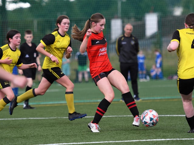 An Irvinestown Wanderers controls the ball in midfield during their girls under-13's match against Dunree FC.