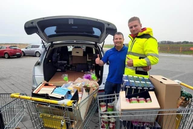 Micky Kelly with a friend in April when he drove to the Lviv Oblast with a consignment of goods from Derry.