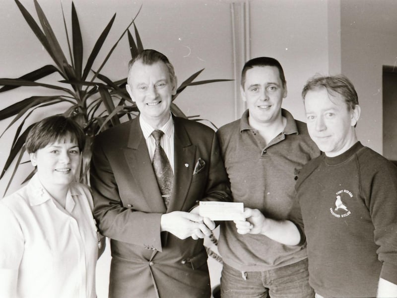 Drt Tom McGinley, founder Foyle Hospice receiving a cheque back in 1994.