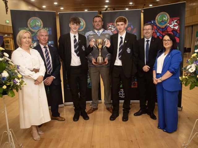Oran Donnelly 12A, and Conor O’Donnell 12C receiving the Culmore GAA KS4 Gaelic Football Award from Mr. D. McErlean, chair, Culmore GAC at Thursday's prizegiving. Included from left are Mr. and Mrs. N. Downey, guest speaker and his wife, Mr. J. Johnstone, Vice Principal and Mrs. C. McLaughlin, Principal.