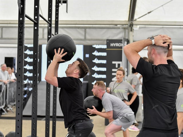 This participant closes in on the finish line as he finishes the wallball stations at the Ebrington Hyrox on Saturday morning. Photo: George Sweeney