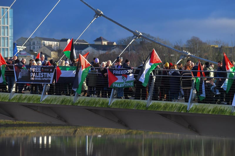 Hundreds of people gather on Derry’s Peace Bridge, on Sunday afternoon, in solidarity with Gaza and Palestinians. Photo: George Sweeney.