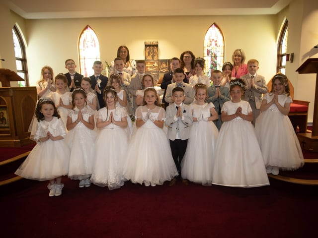 ST. THERESE' FIRST COMMUNION . . . . .Children from St. Therese Primary School, Slievemore who received the Sacrament of First Holy Communion from Fr. Roni Zacharias, CC,at St. Joseph's Church, Galliagh on Friday afternoon. Included are teachers and classroom assistants.. (Photo: Jim McCafferty Photography)