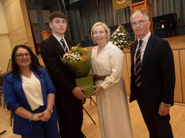 The guest speaker Mr Niall Downey and Mrs Downey receiving a presentation from Head Prefect Somhairle McFadden at the St. Columb's College prizegiving on Thursday night last. On left is Principal, Mrs Caroline McLaughlin.