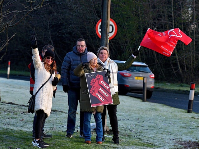 Striking health and social care workers picket outside Gransha on Monday morning. Photo: George Sweeney. DER2250GS – 09
