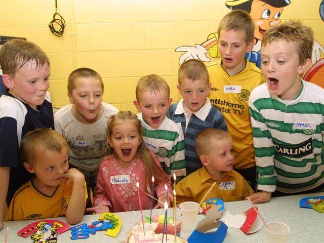 Michaela blows out her candles with a little help from her friends