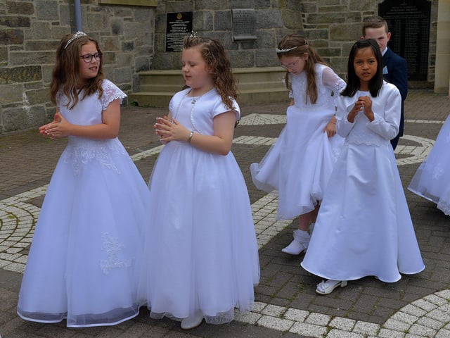 Children from schools in the Long Tower parish, who made their First Holy Communion recently, take part in the Solemnity of Corpus Christi procession, in the ground of the church, on Sunday afternoon. Photo: George Sweeney. DER2324GS –