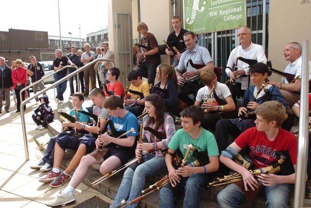 Musicians give an impromptu performance on the pipes outside Scoil Eigse during the opening day of the Fleadh. (DER3113PG017)