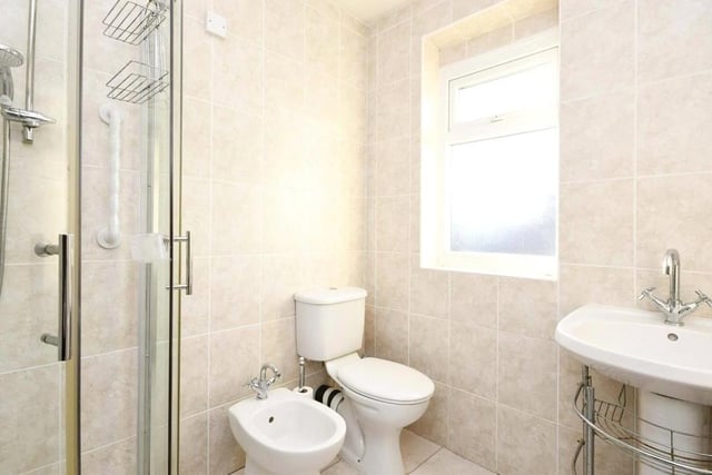 Also on the first floor is this shower room, which comprises shower cubicle, low-flush WC and wash hand basin.