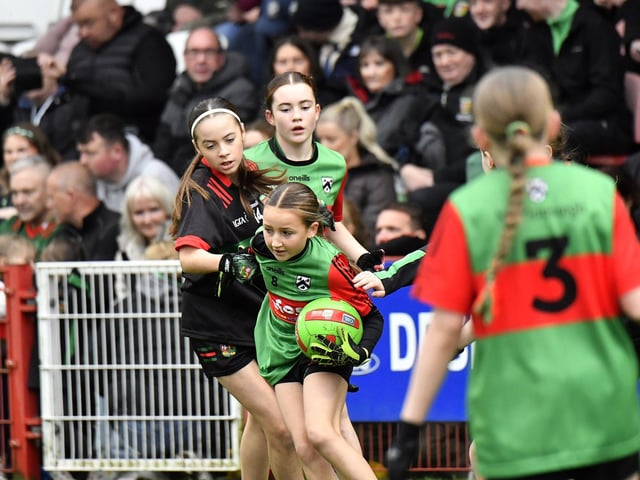 Young footballers from Doire Trasna and Slaughtmanus Under 12 teams play at half-time at the Derry Junior Football Championship Final held in Celtic Park on Sunday afternoon. Photo: George Sweeney