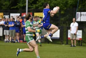 Cahir McMonagle of Steelstown gets the ball ahead of Faughanvale’s Michael Sweeney.  Photo: George Sweeney
