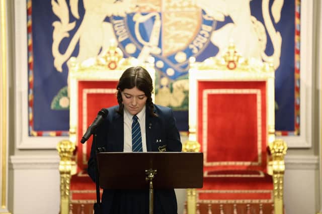 Erin Whoriskey at Hillsborough performing her poem on the Good Friday Agreement