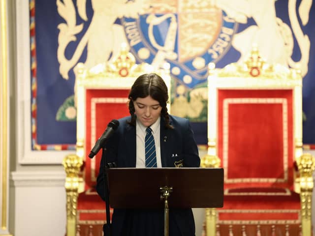 Erin Whoriskey at Hillsborough performing her poem on the Good Friday Agreement