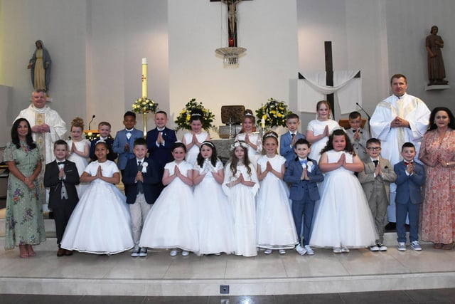 FIRST HOLY COMMUNION . . . . .Pupils from Mrs. McMenamin’s P4 class at Holy Child PS, Creggan who received the Sacrament of First Holy Communion from Fr. Ignacy and Fr. McFaul at St. Mary's Church on Sunday morning last. Included on left is Ms. Patti Concannon, Principal. (Photos: Jim McCafferty Photography)