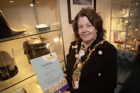 The Mayor, Patricia Logue proudly shows off her certificate after completing the DEEDS Dementia Immersive Experience Tier 1 Programme at the Guildhall on Monday afternoon. (Photos: Jim McCafferty Photography)