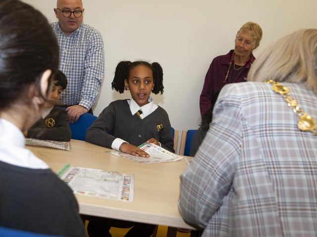 Primary 6 pupil Maame explains some of her traditions and cultures to the Mayor during her visit to Model PS this week.