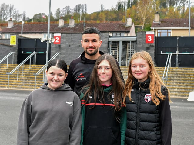 Derry City’s Michael Duffy has his picture taken with fans on Saturday morning prior to the team’s departure for Dublin ahead of Sunday’s FAI Cup Final against Drogheda United.  Photograph: George Sweeney.