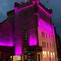 The Magee campus will join Camera Obscura - Edinburgh (pictured) to shine brightly in the charity’s colours, pink, purple and teal, as part of the national campaign designed to “Shine a Light” on Secondary Breast Cancer Day.