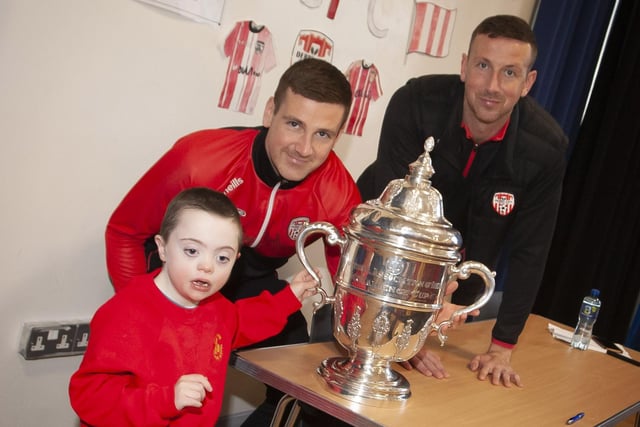 Patrick and Shane pictured with young Callum during their visit to Steelstown Primary School this week. (Photo: Jim McCafferty)