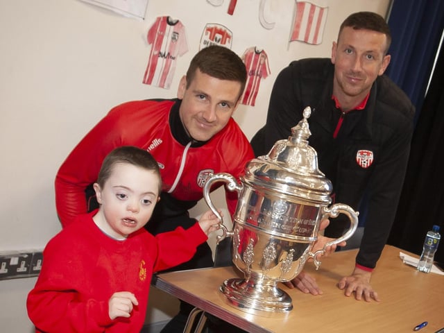 Patrick and Shane pictured with young Callum during their visit to Steelstown Primary School this week. (Photo: Jim McCafferty)