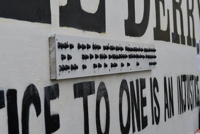 The new Braille sign on Free Derry Corner unveiled by Richard Moore on Tuesday afternoon. The sign reads ‘You Are Now Entering Free Derry’. Photo: George Sweeney. DER2305GS – 68