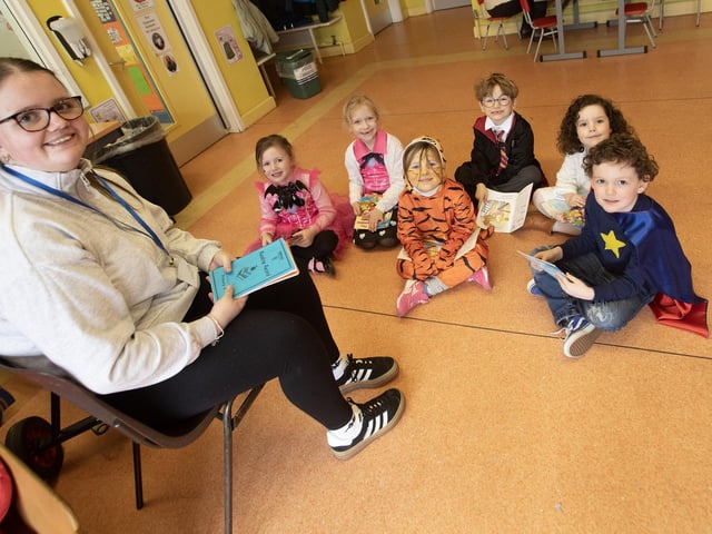 Hollybush PS primary 1s get in some reading practice on Thursday at the school.