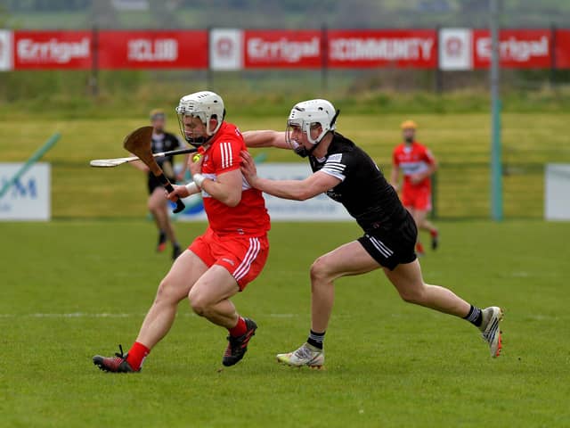 Derry’s Cormac O’Doherty shields the sliothar from Sligo’s Niall Kilcullen during the game in Owenbeg on Sunday afternoon. Photo: George Sweeney. DER2317GS – 02