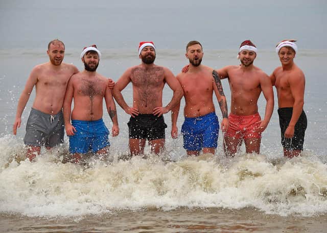 Relatives of the late Lena Boyle took part in the annual Christmas morning charity swim at Ludden beach, Buncrana. Photo: George Sweeney. DER2252GS – 26
