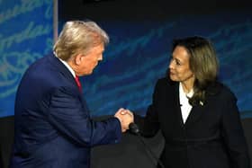 US Vice President and Democratic presidential candidate Kamala Harris (R) shakes hands with former US President and Republican presidential candidate Donald Trump during a presidential debate at the National Constitution Centre in Philadelphia, Pennsylvania, on September 10, 2024. (Photo by SAUL LOEB / AFP) (Photo by SAUL LOEB/AFP via Getty Images)