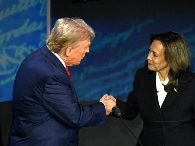 US Vice President and Democratic presidential candidate Kamala Harris (R) shakes hands with former US President and Republican presidential candidate Donald Trump during a presidential debate at the National Constitution Centre in Philadelphia, Pennsylvania, on September 10, 2024. (Photo by SAUL LOEB / AFP) (Photo by SAUL LOEB/AFP via Getty Images)