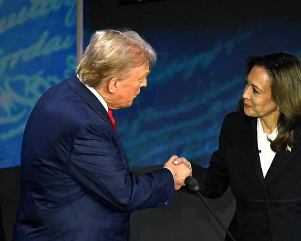 US Vice President and Democratic presidential candidate Kamala Harris (R) shakes hands with former US President and Republican presidential candidate Donald Trump during a presidential debate at the National Constitution Centre in Philadelphia, Pennsylvania, on September 10, 2024. (Photo by SAUL LOEB / AFP) (Photo by SAUL LOEB/AFP via Getty Images)