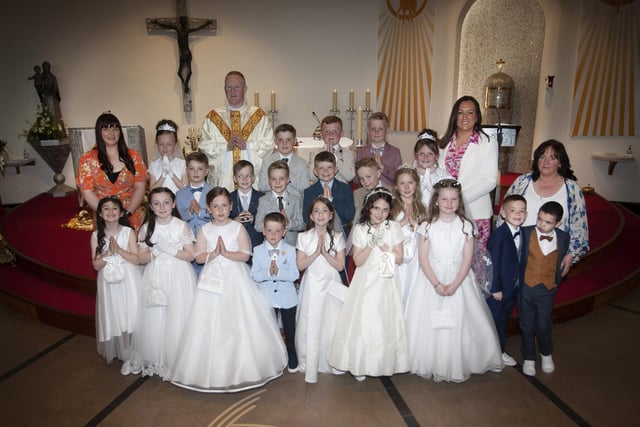 Pupils from Mrs. Cunningham’s P4 Class at Greenhaw Primary School who received the Sacrament of First Holy Communion on Friday last at St. Brigid’s Church, Carnhill from Fr. Sean O’Donnell. Included in photo are Miss Quigley and Mrs. Wilson, Classroom Assistants. (Photo: Jim McCafferty Photography)