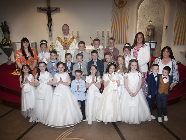 Pupils from Mrs. Cunningham’s P4 Class at Greenhaw Primary School who received the Sacrament of First Holy Communion on Friday last at St. Brigid’s Church, Carnhill from Fr. Sean O’Donnell. Included in photo are Miss Quigley and Mrs. Wilson, Classroom Assistants. (Photo: Jim McCafferty Photography)