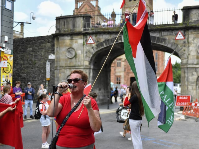 Catherine Hutton, Chairperson of Derry IPSC, speaking at the ‘Turn Shipquay Street Red for Gaza’ march on Saturday afternoon. Photo: George Sweeney