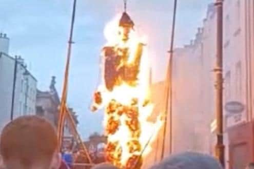 An effigy of Robert Lundy burning in Bishop Street last year.