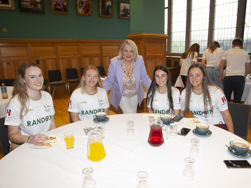 The Mayor, Sandra Duffy pictured with some of the successful University of Ulster at Magee camogie players on Tuesday evening at the Guildhall. From left, Niamh Dempster, Hannah Mullan, Aoibheann Barrett and Siobhan McKinley.