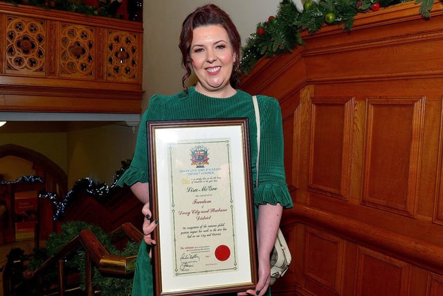 Lisa McGee, creator of Derry Girls, who was conferred with the Freedom of Derry City and Strabane by councillors yesterday evening pictured with her parents Anne and Chris in the Guildhall. Photo: George Sweeney. DER2249GS â€“ 
