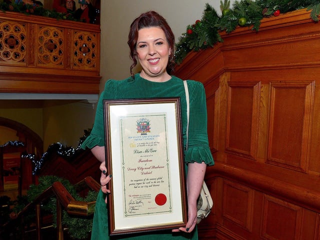 Lisa McGee, creator of Derry Girls, who was conferred with the Freedom of Derry City and Strabane by councillors yesterday evening pictured with her parents Anne and Chris in the Guildhall. Photo: George Sweeney. DER2249GS â€“ 