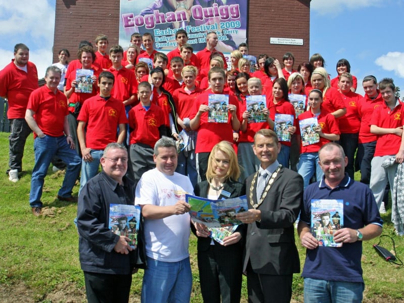 The Deputy Mayor of Derry, Councillor Maurice Devenney (second right) pictured at the launch of the Earhart Festival brochure at Bloomfield Park yesterday. Front from left, Councillor Tony Hassan, Ollie Green, festival director, Clare McCauley, Medicare, sponsors of this year's event, and Bobby Kelly, chairman, Greater Shantallow Arts. At back are the 'Redshirts' Festival Volunteers. 2807JM07